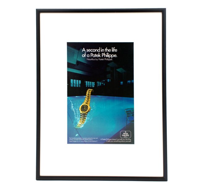 Authentic framed 1980 Vintage Print Ad Patek Philippe Nautilus - "A second in the life of a Patek Philippe"