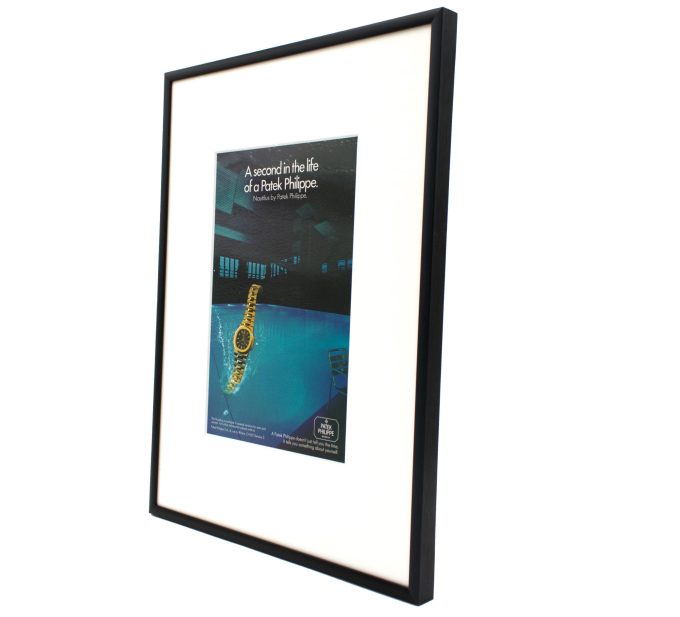 Authentic framed 1980 Vintage Print Ad Patek Philippe Nautilus - "A second in the life of a Patek Philippe"