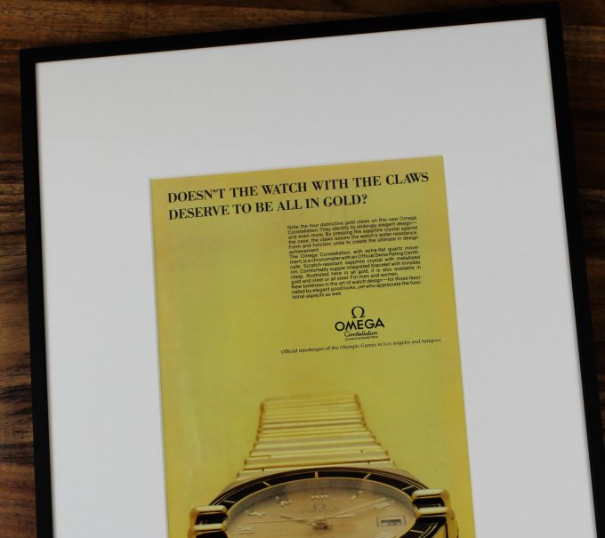 Authentic framed 1984 Omega Constellation “Claws” Full Gold Edition Print Ad