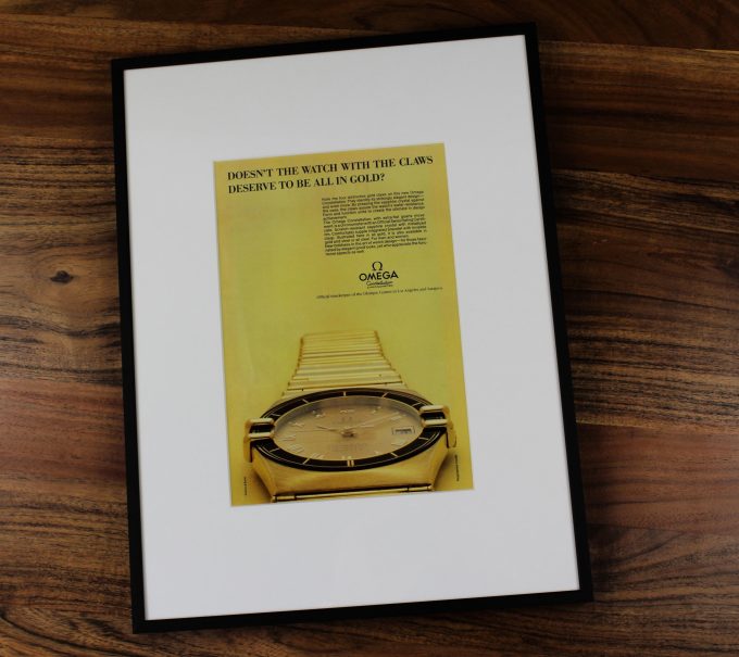 Authentic framed 1984 Omega Constellation “Claws” Full Gold Edition Print Ad